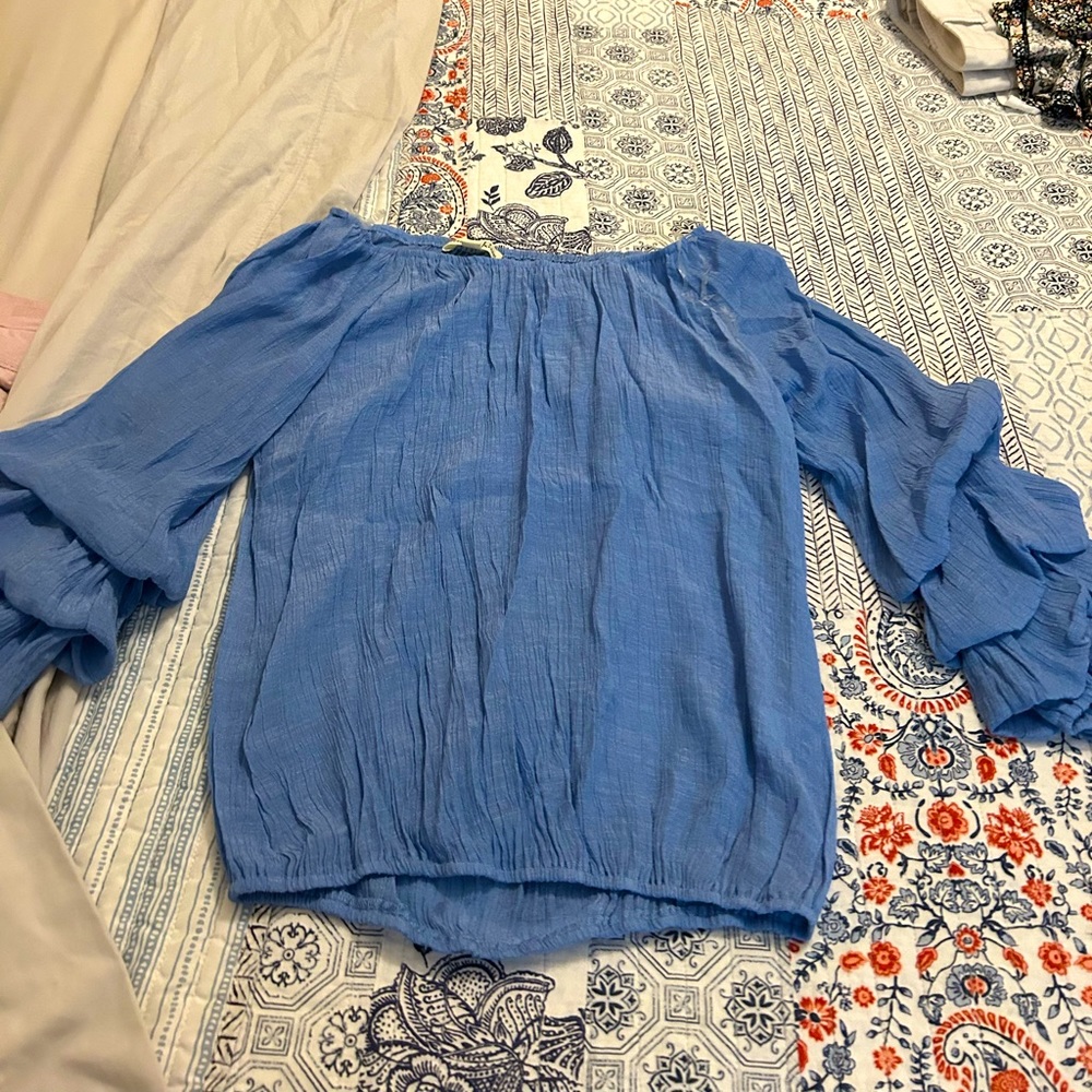 Never worn before long sleeve with ruffle sleeves